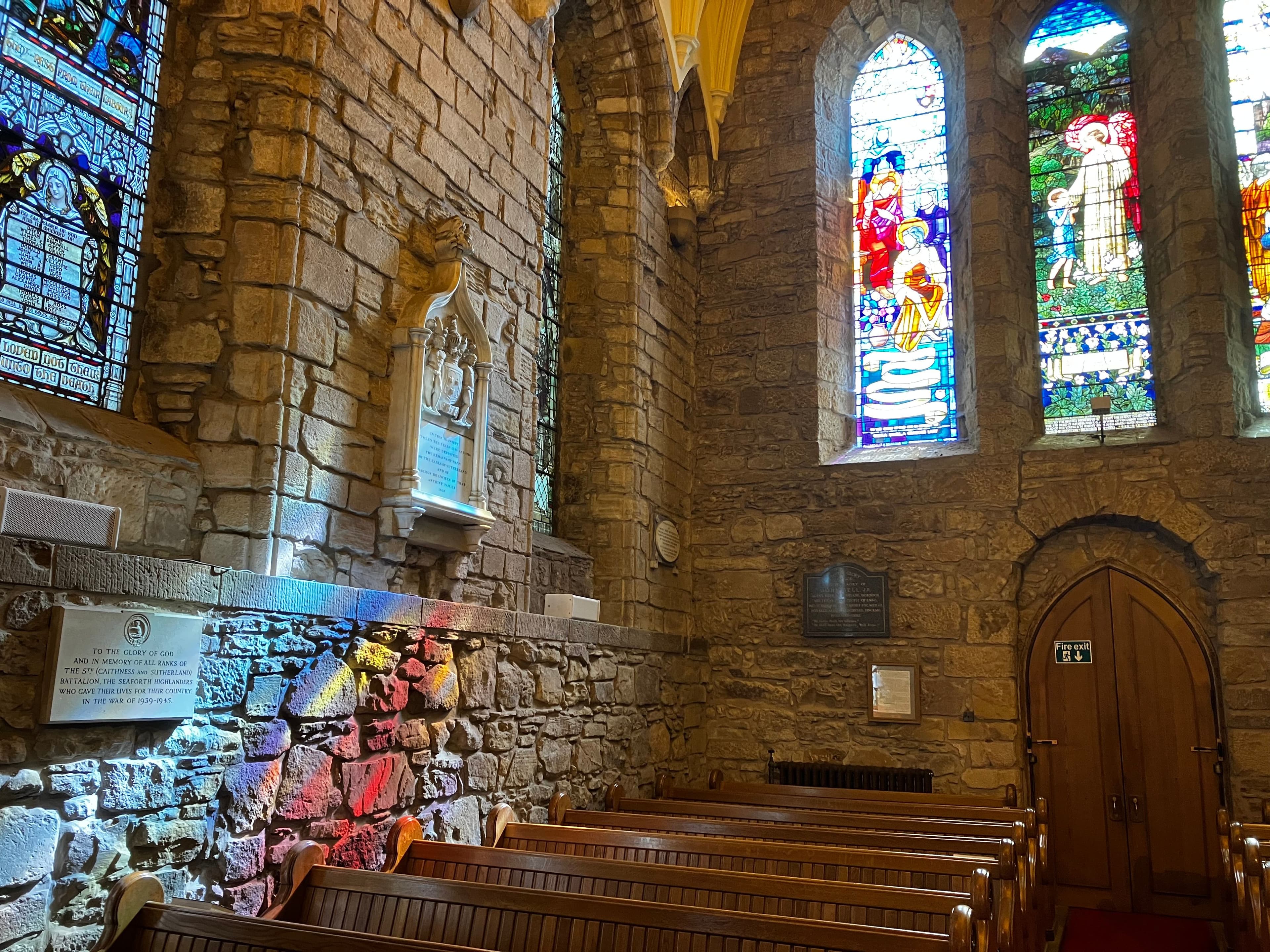 Sunlight through stained glass windows creates a rainbow inside Dornach Cathedral